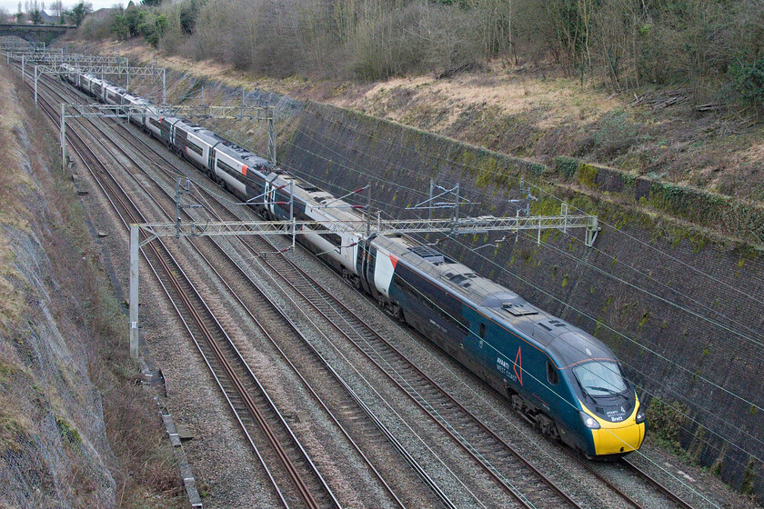 390129, 11.30 Wembley IC Depot-Manchester Piccadilly ECS (5H42, RT), Roade cutting 
 It is unusual for Avanti to run empty coaching stock trains but three were noted on RTT over this Sunday. One of those, 5H42, the 11.30 Wembley Yard to Manchester Piccadilly passes through Roade cutting worked by 390129 'City of Stoke-on-Trent'. I suspect that the reason for these relatively wasteful workings was that trains were in the wrong places following the previous day's industrial action. 
 Keywords: 390129 11.30 Wembley IC Depot-Manchester Piccadilly ECS 5H42 Roade cutting AWC Pendolino City of Stoke-on-Trent