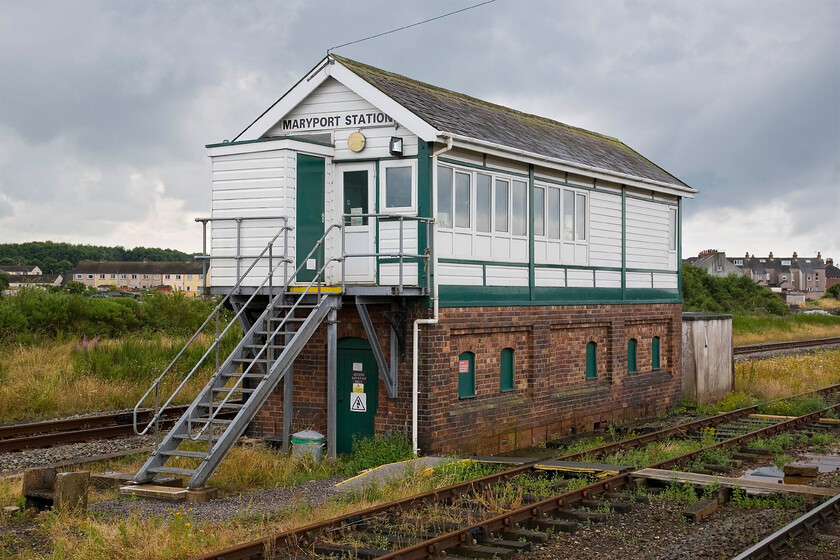 Maryport Station signal box (LMS, 1933) 
 There was once a very grand station at Maryport that was built to serve the many Edwardian visitors who flocked to the quaint little seaside town on the Cumbrian coast. Today nothing remains of this station with just a meagre single platform and a waiting shelter. However, the rather grand LMS signal box remains that dates from 1933. The box has been 'modernised' with cladding, UPVC windows and modern steel steps that support a personal needs facility. I do just wonder if the nameboard is the original. If so it should be white writing on a red background, thoughts anybody? 
 Keywords: Maryport Station signal box LMS