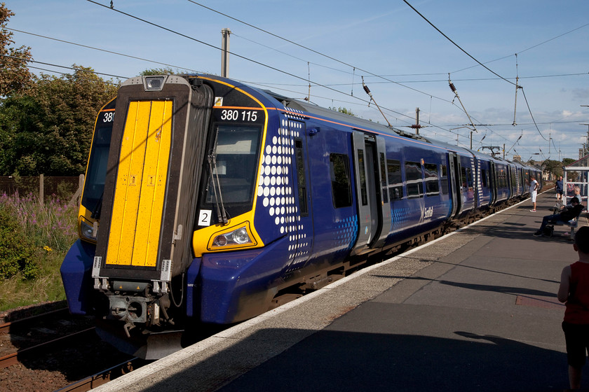 380115, SR 16.31 Glasgow Central-Largs (1T21, 1L), Ardrossan South-Beach station 
 380115 pauses at Ardrossan South Beach station working the 16.31 Glasgow Central to Largs. For a simple station, South Beach station was surprisingly busy. 
 Keywords: 380115 1T21 Ardrossan South Beach-station