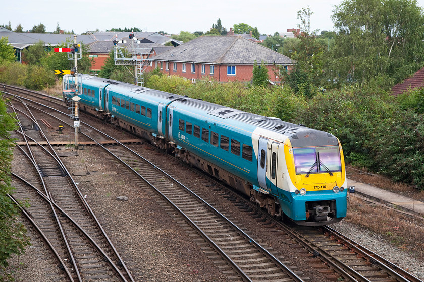 175110, AW 12.30 Manchester Piccadilly-Milford Haven (1V42), Sutton Bridge Junction 
 175110 leaves Shrewsbury past Sutton Bridge Junction forming the 12.30 Manchester Piccadilly to Milford Haven. The area behind the train was once occupied by an area of extensive yards but like so much of the railway network, this has been sold off and now built on, in this case by an estate composed of small office units and a large Jaguar dealership. 
 Keywords: 175110 12.30 Manchester Piccadilly-Milford Haven 1V42 Sutton Bridge Junction