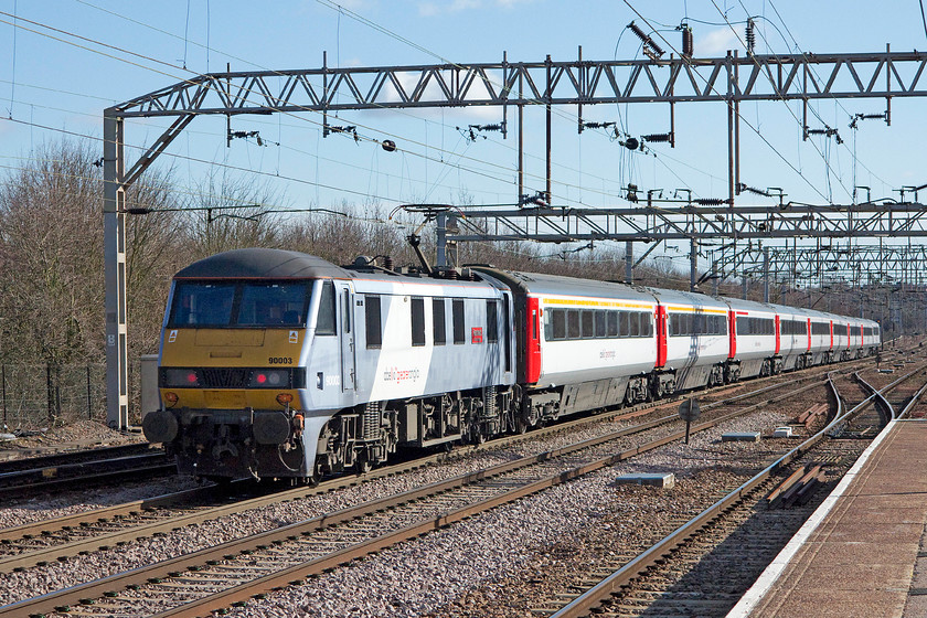 90003, LE 09.30 London Liverpool Street-Norwich (1P16), Colchester station 
 90003 'Rdwald of East Anglia' propels the 09.30 Liverpool Street to Norwich out of Colchester. On this occasion, the uniform set of Abelio stock is spoilt by the loco. that remains in its older livery! The blue sky belies the fact that it was a chilly and windy early spring day 
 Keywords: 90003 09.30 London Liverpool Street-Norwich 1P16 Colchester station