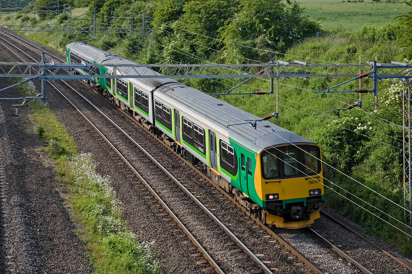 150109 & 153375, 16.54 Tyseley LMD-Bletchley CS (5B03), Victoria bridge 
 The Marston Vale line between Bedford and Bletchley is operated by London Midland units of various types. They operate services for a week before returning to Birmingham for servicing with some other units replacing them These swapovers take place on Sundays as seen here with 150109 and 153375 heading south as the 16.54 Tysley LMD to Bletchley CS 5B03 working. These two units will operate Marston Vale services for the coming week. 
 Keywords: 150109 153375, 16.54 Tyseley LMD-Bletchley CS 5B03 Victoria bridge London Midland Marston Vale