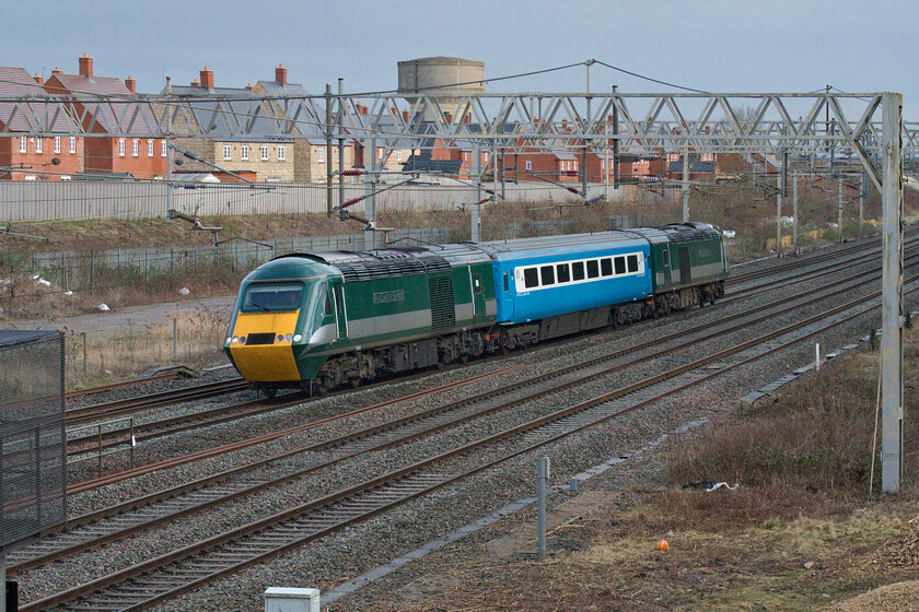 43058 & 43059, 11.10 Eastleigh Arlington-Crewe HS (5Z44), site of Roade station 
 Superpower for just one Mk. III coach as it passes Roade in some brighter afternoon sunshine. Wearing Rail Charter Services livery former EMR power cars 43058 and 43059 work the 5Z44 11.10 Eastleigh (Arlington) to Crewe HS move conveying coach 41108 that had been receiving attention at the Hampshire facility. The enduring popularity of these fine trains remains as strong as ever with these two power cars expected to be working in the northwest for another summer on the Staycation Express services. I photographed both of these power cars when in service with EMR, for example, see.... https://www.ontheupfast.com/p/21936chg/24862204204/x43045-43076-1b73-harrowden-junction 
 Keywords: 43058 43059 11.10 Eastleigh Arlington-Crewe HS 5Z44 site of Roade station HST Rail Charter Services