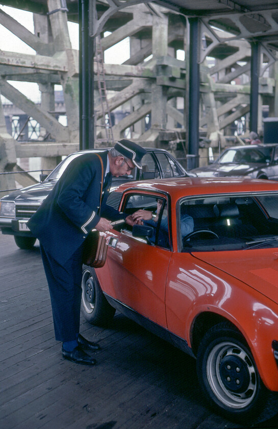 Collecting fares, New Holland Pier 
 Fares to cross the Humber between Hull and New Holland could be bought at the ticket office on New Holland Town station, on the trains with connecting fares through to Hull or like this, directly upon embarking. The Triumph TR7 driver is seen handing over his fare to one of the MV Farringford's crew members who will issue the ticket. The crew members were employed by Sealink which was the brand name for the ferry services of British Rail in the United Kingdom. Most people would associate Sealink with the larger channel operations from the likes of Dover and Folkstone but they also operated other minor crossings such as to and from the Isle of Wight and here on the Humber. 
 Keywords: Collecting fares New Holland Pier