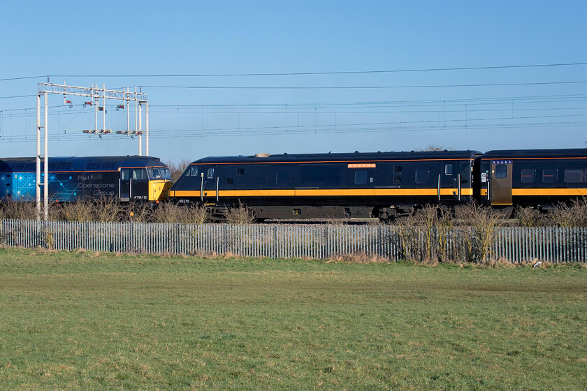 47812 & 82230, 06.44 Eastleigh Arlington-Worksop Down Reception (5Q26), Wilson's Crossing 
 The last time I saw DVT 82230 it was heading south last summer, see.... https://www.ontheupfast.com/p/21936chg/29375099604/x90026-90020-82230-17-20-widnes-transport in hopeful anticipation of the start of staff training runs so that Grand Central could commence its Blackpool to Euston services. However, since then, COVID has thwarted these attempts with the plans now completely abandoned. Therefore, the repainted stock, including the DVT, is seen here at Wilson's Crossing near Northampton returning north to Worksop for storage and an uncertain future. The stock is seen being led by Rail Operations Group's 47812. 
 Keywords: 47812 82230 06.44 Eastleigh Arlington-Worksop Down Reception 5Q26 Wilson's Crossing ROG Rail Operations Group GC Grand central DVT