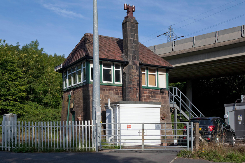 Park South signal box (Furness, 1883) 
 When I last visited Park South signal box in October 1985 there was no huge road viaduct in the background. Also, finding it using my Ordnance Survey map of the same vintage led to some problems with roads that didn't exist anymore but, in the end, with a bit of a 'gut feeling' we found it nestling down in the valley just north of Barrow-in-Furness. Park South signal box is Furness Railway type 3 structure dating from 1883. It is located a few yards north of Park South Junction that was formally named Thwaite Flat Junction. It controls manually the level crossing on the minor road that drops steeply down from Dalton. 
 Keywords: Park South signal box