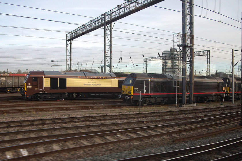 67024, 67006 & 67005, stabled, Wembley Yard 
 A trio of stabled class 67s are seen in Wembley Yard. Dedicated Belmond Pullman branded 67024 looks smart in its colour scheme very similar to the the old GWR 'Chocolate and Cream'. The Royal Train's 67006 'Royal Sovereign' and 67005 'Queen's Messenger' stand awaiting their next duty 
 Keywords: 67024 67006 67005 Wembley Yard