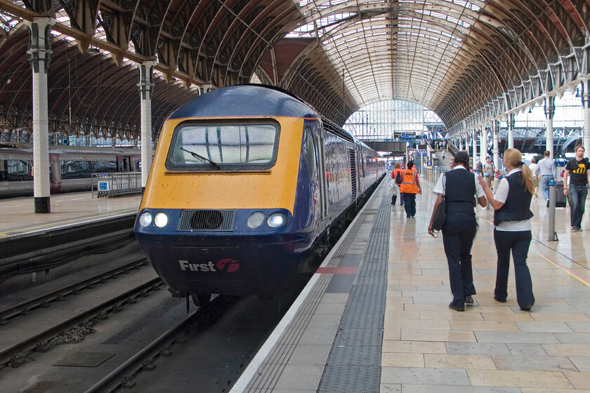 43176, GW 12.00 Bristol Temple Meads-London Paddington, London Paddington station 
 The 12.00 HST service from Bristol Temple Meads is just arriving at Paddington station led by power car 43176. Cleaning staff and train crew are seen walking along the platform to prepare the train once the passengers have disembarked readying it for its returning west-bound working. 
 Keywords: 43176 12.00 Bristol Temple Meads-London Paddington London Paddington station FGW First Great Western HST