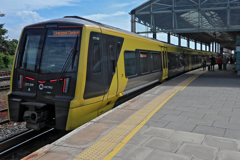 777019, ME 10.13 Rock Ferry-Chester (2C15, RT), Chester station 
 I thought that when Andy and I travelled on Merseyrail's 10.13 Rock Ferry to Chester service from Liverpool Central that we were both travelling on virgin track. For Andy it was but I realised that I had traversed part of this route back in 1984 between Hooton and Rock Ferry on the Conwy Crusader railtour on 10.03.84 behind 40029; today we had to make do with the newly introduced 777019! The train is seen after arrival at Chester. Photographs of the fabled Conwy Crusader railtour will be uploaded when I get to processing my 1984 images. At the present rate of progress, this will be in about ten years! 
 Keywords: 777019 10.13 Rock Ferry-Chester 2C15 Chester station Merseyrail