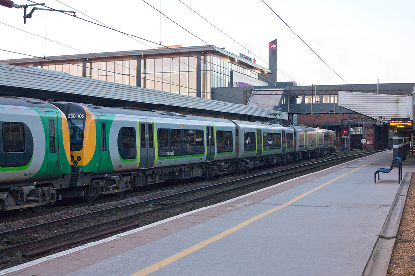 350105, LM 06.18 Northampton-London Euston (1N78), Northampton station 
 With a strange early morning light being picked up on the glass wall of Northampton's new station, 350105 waits to leave, with another member of the class, as the 1N78 06.18 Northampton to Euston. 
 Keywords: 350105 06.18 Northampton-London Euston 1N78 Northampton station