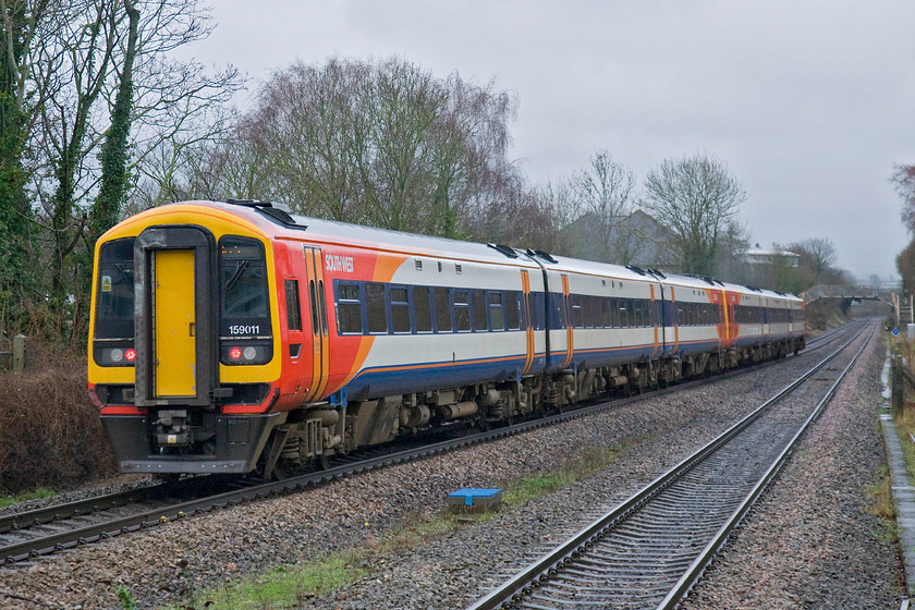 159011 & 159005, SW 10.25 Exeter St. David's-London Waterloo (1L40), Andover station 
 159011 and 159005 leave Andover station in the pouring rain working the 10.25 Exeter st. David's to London Waterloo train. For once it is good to see that a decent length service composed of six through connected carriages working a service such as this. Even when the Class 50s and 47s were hauling these services back in the 1980s trains were often shorter than this. 
 Keywords: 159011 159005, SW 10.25 Exeter St. David's-London Waterloo 1L40 Andover station