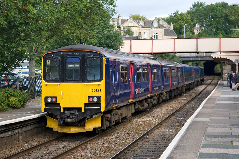 150121 & 158961, GW 14.30 Cardiff Central-Portsmouth Harbour (1F23), Bradford-on-Avon station 
 150121 and 158961 pauses at Bradford-on-Avon station working the 14.30 Cardiff Central to Portsmouth Harbour service. I spent hours at this station in my early spotting career being a resident of the town. Indeed, I spent the first five years of my life living in a small terraced house behind the grand stone-built house above the station footbridge. 
 Keywords: 150121 158961 GW 14.30 Cardiff Central-Portsmouth Harbour 1F23 Bradford-on-Avon station First Great Western