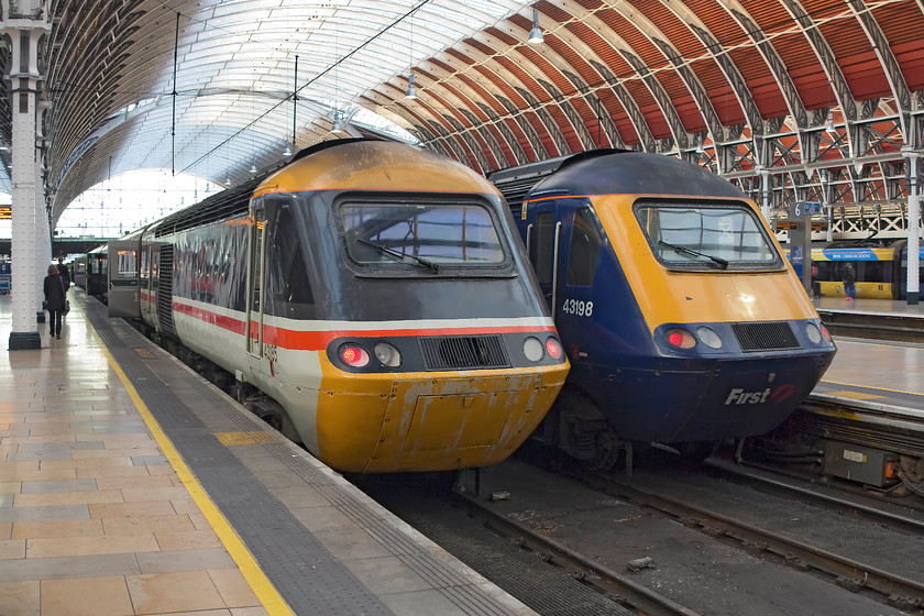 43185, GW 12.00 Bristol Temple Meads-London Paddington & 43198, 11.29 Exeter St. David`s-London Paddington ECS (5Z70), London Paddington station 
 Retro painted 43185 'Great Western' is in its BR swallow livery as it sits at Paddington having arrived with the 12.00 from Bristol Temple Meads. It's a shame that in their haste to repaint the HST power car that the paint has been applied in a bit of a rush or was of poor quality judging by the amount of it flaking off. Next to the celebrity power car is 43198 that has also recently arrived leading the 5X70 11.29 ECS from Exeter St. David's. 
 Keywords: 43185 12.00 Bristol Temple Meads-London Paddington 43198 11.29 Exeter St. David`s-London Paddington ECS 5Z70 London Paddington station