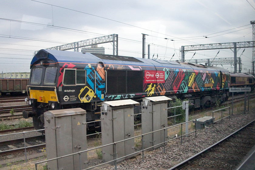 66718, stabled, Wembley Yard 
 66718 'Sir Peter Hendy CBE' in its TFL livery is seen stabled in Wembley Yard. Two of GBRFs 66s (66718 and 66721) were treated in different, but dramatic, vinyls to commemorate the successful completion of their 10-year long contract to run infrastructure trains. 
 Keywords: 66718 Wembley Yard