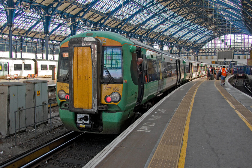 377162, SN 16.00 Brighton-Portsmouth & Southsea (1S28, RT), Brighton station 
 My train to Lancing waits at Brighton. I travelled aboard 377162 working the 16.00 to Portsmouth and Southsea. Another hot day with temperatures in excess of thirty degrees Celsius found me appreciating the efficient air conditioning in these units that consistently seemed to work on every unit I travelled on! 
 Keywords: 377162 16.00 Brighton-Portsmouth & Southsea 1S28 Brighton station Southern Electrostar