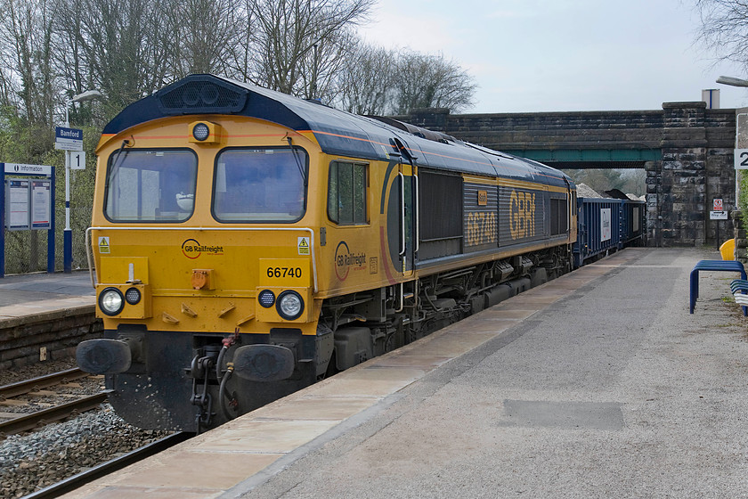 66740, 14.23 Tunsted Sidings-Wellingborough TC, Bamford station 
 66740 'Sarah' passes at speed through Bamford station. It has recently left Tunsted sidings with the 14.23 loaded stone train to Wellingborough. How ironic that Andy have travelled all the way to the Pennines only to photograpgh a freight train heading to a location a short distance from where we both live! 
 Keywords: 66740 14.23 Tunsted Sidings-Wellingborough TC Bamford station