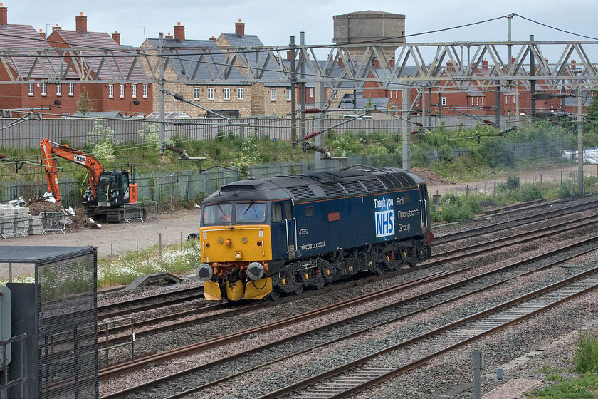 47813, 11.05 Wolverton Centre sidings-Derby RTC (0M60, 1L), site of Roade station 
 47813 'Jack Frost' has just set off from Wolverton Works a short distance south from this location in Roade. It is running as the 0M60 11.05 to Derby RTC. The previous day it hauled a Wessex Class 442 from Bournemouth depot to Wolverton where it rested overnight. As well as having its traditional red nameplate and Rail Operations Group branding it has had a large 'Thank You NHS' vinyl applied during the COVID-19 pandemic. 
 Keywords: 47813 11.05 Wolverton Centre sidings-Derby RTC 0M60 site of Roade station Jack Frost