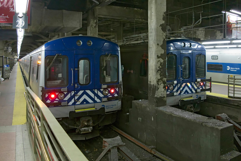 4050, unidentified working, 4326, 13.25 New York Grand Central-North White Plains & 6109, unidentified working, New York Grand Central station 
 Platforms twenty nine, thirty and thirty one of new York Grand Central station all have trains on them. On tracks thirty one and thirty two are two Bombardier M7A units, 4050 and 4326. The latter is soon to depart with the 13.25 to North White Plains, a district of north east New York. On the far side, 6109, one of the new Kawasaki M8 units, sits on track thirty one. 
 Keywords: 4050 4326 13.25 New York Grand Central-North White Plains 6109 New York Grand Central station