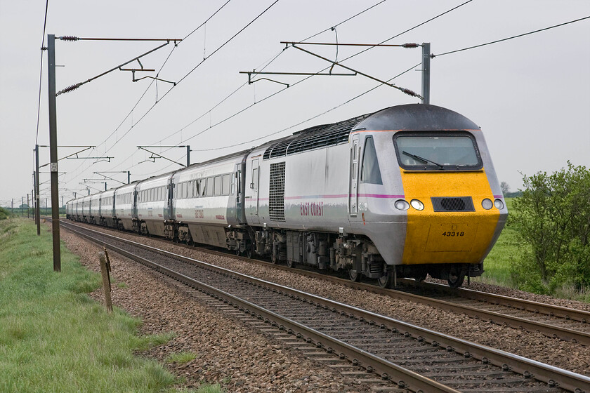 43318, GR 09.40 Inverness-London King's Cross (1E17), Frinkley Lane crossing SK906436 
 HST power car 43318 has covered four hundred and fifty-two miles of its journey with a mere one hundred and fourteen to go as it leads the 09.49 Inverness to King's Cross past Frinkley Lane between Grantham and Newark. As 43118 this power car was introduced in May 1979 as part of the final allocated set to the ECML, 254032. 
 Keywords: 43318 09.40 Inverness-London King's Cross 1E17 Frinkley Lane crossing SK906436 East Coast HST