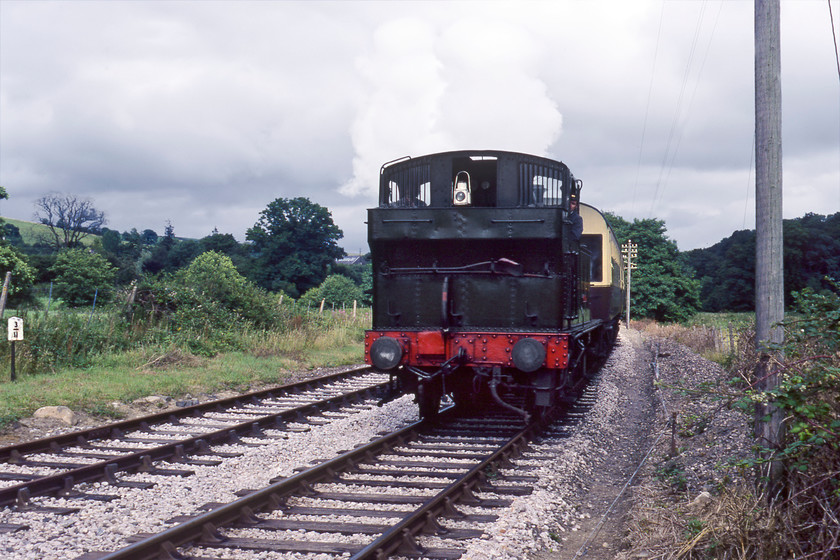 1450, 16.10 Totnes-Buckfastleigh, Staverton Bridge SX781636 
 The 16.10 Totnes Riverside to Buckfastleigh service leaves Staverton Bridge station on the Dart Valley Railway (now operating as the South Devon Railway) led by Collett 1450. I am not a fan of tender-first photographs with this one clearly illustrating why! The photograph is taken from an occupation crossing.

There is an audio recording of this event on my youtube channel, see....https://youtu.be/C8Z8rqUNViM 
 Keywords: 1450 16.10 Totnes-Buckfastleigh Staverton Bridge SX781636