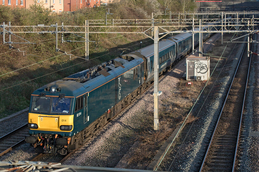 92014, CS 01.29 Edinburgh Waverley-London Euston (1M16, 15L), site of Roade station 
 Something had obviously gone wrong earlier in its journey as the up sleeper (along with its down twin the only two operating during the COVID 19 pandemic) was twenty minutes late as it passed the site of Roade station. I am not sure if 92014 had led the train all the way as it was listed on RTT as having a diesel at Edinburgh and it went 'off course' between Goldbourne Junction and Crewe. Arrival into Euston was fifteen minutes adrift. 
 Keywords: 92014 01.29 Edinburgh Waverley-London Euston 1M16 site of Roade station Caledonian Sleeper