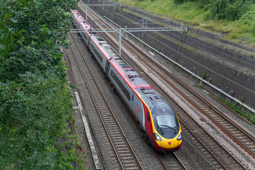 390155, VT 11.55 Manchester Picadilly-London Euston (1A31), Roade Cutting 
 390155 'X-Men: Days of Future Past' passes through Roade Cutting forming the 11.55 Manchester Piccadilly to Euston. 
 Keywords: 390155 11.55 Manchester Picadilly-London Euston 1A31 Roade Cutting