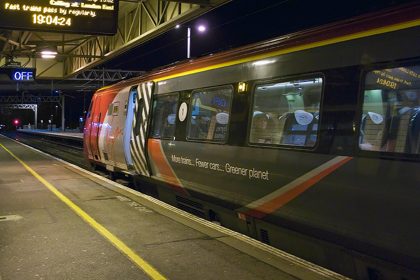 221115, VT 13.55 Glasgow Central-London Euston (9M57), Milton Keynes Central station 
 The train that we took home from Birmingham to Milton Keynes pauses at Central station after we have alighted. In this image, the unique livery of 221115 'Polmadie Depot' is seen as it works the 13.55 Glasgow Central to Euston. This image was subject to some camera shake due to the long exposure, but it has been improved greatly with judicious use of Photoshop and Neat Image. 
 Keywords: 221115 13.55 Glasgow Central-London Euston(9M57 Milton Keynes Central station