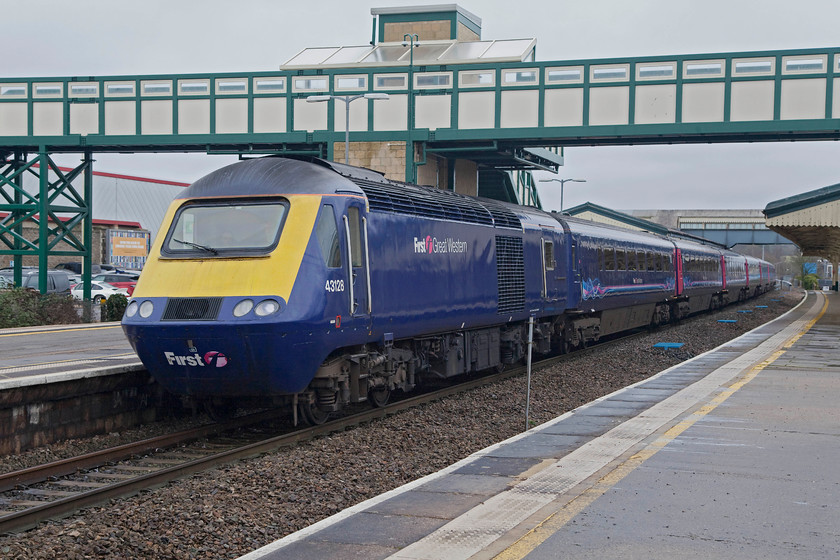 43128, GW 12.00 London Paddington-Bristol Temple Meads (1C13, 6L), Chippenham station 
 After my neck treatment in Box, I drove the short distance to Chippenham to collect Andy who had travelled from Bath. He had been lucky enough to travel with celebrity HST 43002 'Sir Kenneth Grange'. 43128 arrives into Chippenham at the front of the 12.00 Paddington to Bristol Temple Meads, the 1C13. 43128 was part of set 253029 that was derived during 1981 to the Western Region. 
 Keywords: 43128 1C13 Chippenham station