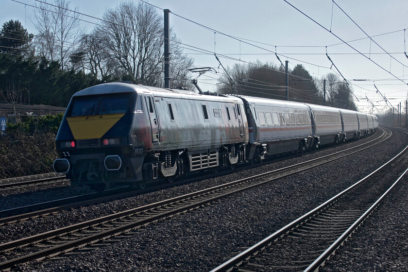 91111, GR 11.15 Leeds-London King's Cross (1A26, 3L), Arlesey station 
 I don't normally 'do' going away shots but when the subject is 91111 'For the Fallen' I have made an exception! Bringing up the rear of the 1A26 11.15 Leeds to King's Cross it is seen passing south through Arlesey station at line speed with its massive six thousand three hundred hp motor roaring as they always do; a very impressive locomotive in anybody's book! 
 Keywords: 91111 11.15 Leeds-London King's Cross 1A26 Arlesey station LNER IC225 For the Fallen