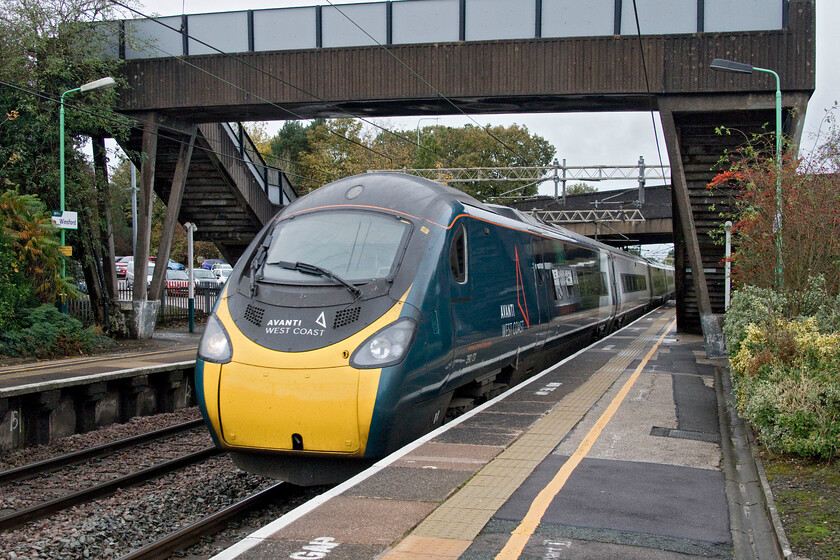 390131, VT 12.47 Liverpool Lime Street-London Euston (1A35, 53L), Winsford station 
 An example of my desire to get a new camera with a higher minimum shutter but still as compact and as excellent as the Canon G1X that is my 'go to' machine. 1:2000/second does not quite freeze 390131 'City of Liverpool' as it passes through Winsford station with the 12.47 Liverpool to Euston 1A35 express. 
 Keywords: 390131 12.47 Liverpool Lime Street-London Euston 1A35 Winsford station City of Liverpool