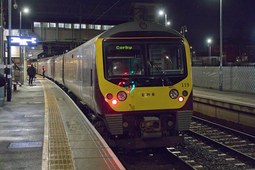 360119, EM 05.32 London St. Pancras-Corby (1Y01, 2L), Kettering station 
 The rear end of 360119 as it pauses at Kettering station working the 05.32 St. Pancras to Corby service. It is astonishing that camera technology permits hand-held photographs to be taken in conditions such as this and that they are of such remarkable quality. Remember the times when a camera needed to be mounted on a sturdy tripod and a bit of a guestimate was required to get a decent image; I would have thought that in these sorts of conditions and exposure of some fifteen seconds would have been required at about f8. Whilst it's easy today I must admit to missing a bit of the old-school tech. and skills! 
 Keywords: 360119 05.32 London St. Pancras-Corby 1Y01 Kettering station EMR Desiro