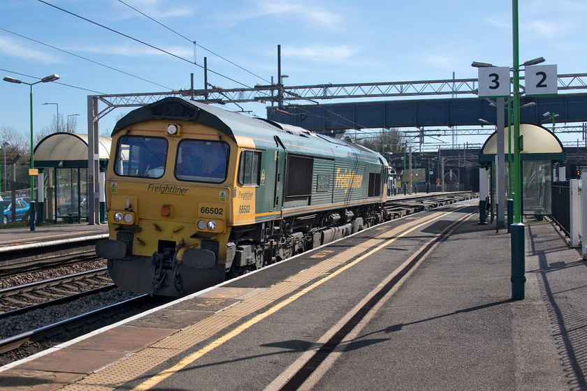 66502, 07.50 Felixstowe North-Lawley Street (4M94, 37E), Wolverton station 
 66502 'Basford Hall Centenary 2001' heads north through a deserted Wolverton station leading the virtually empty 4M94 07.50 Felixstowe North to Hams Hall. The two car parks at Wolverton station are usually full and overflowing with commuters' cars but there was no more than half a dozen cars, of which can be seen behind the station building, on this day three of lockdown. 
 Keywords: 66502 07.50 Felixstowe North-Lawley Street 37E Wolverton station Basford Hall Centenary 2001 4M94