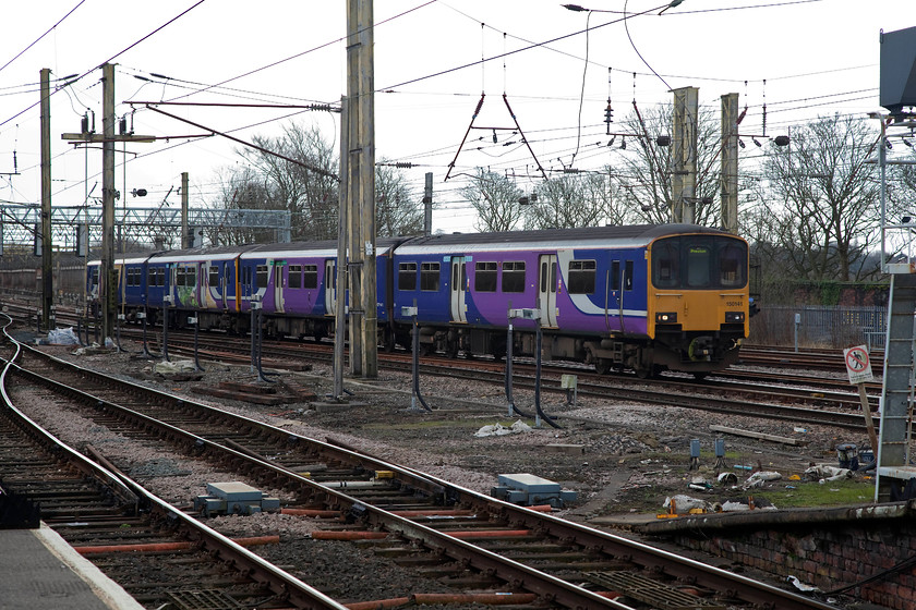 150141 & 150271, NT 13.36 Hazel Grove-Preston (2N27, 1L), Preston station 
 Northern 150141 and 150271 wind their way into Preston station completing their journey from Hazel Grove just 1 minute late. Despite being a bit agricultural, these class 150s have been good performers. These two examples are part of the earlier batch built without cab connecting doors that were constructed in in 1985 and 1986. 
 Keywords: 150141 150271 2N27 Preston station