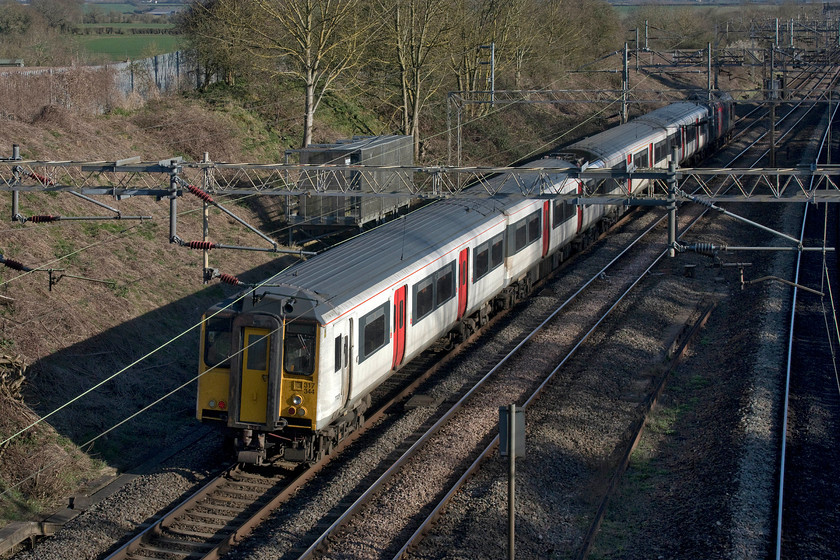 317344 & 37800, 08.28 Kilmarnock Bonnyton Depot-Wolverton Centre Sidings (5Q50, 16E), Victoria bridge 
 Former Greater Anglia 317344 heads south on the WCML dragged by 37800 'Cassiopeia'. The train had left Brodie Engineering's Kilmarnock's facility at 08.28 as the 5Q50 to Wolverton and is seen just south of Roade some seven miles from its destination. 
 Keywords: 317344 37800, 08.28 Kilmarnock Bonnyton Depot-Wolverton Centre Sidings (5Q50, 16E), Victoria bridge Cassiopeia Europhoenix Rail Operation Group ROG Great Anglia GA Abelio