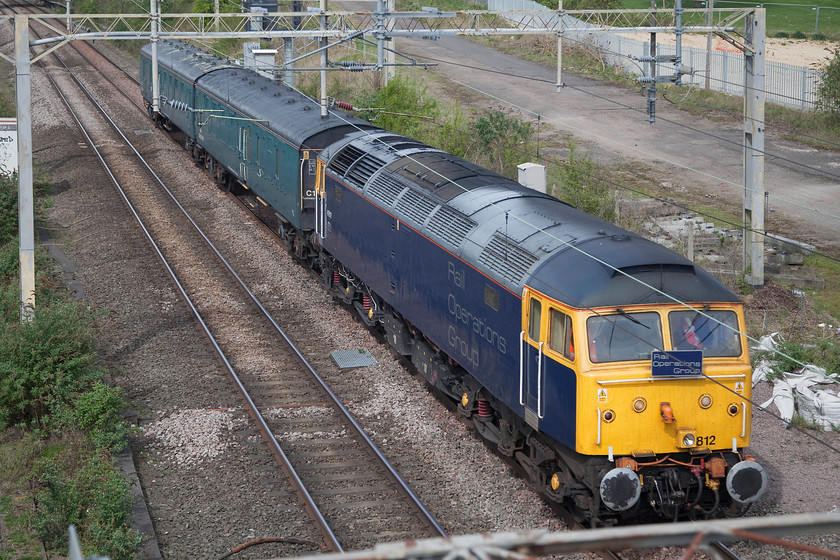 47812, 09.07, Leicester-Wolverton Works (5H70), site of Roade Station 
 Rail Operations Group's 47812 passes the site of Roade station just south of Northampton leading two barrier coaches as the 09.07 Leicester to Wolverton Works. This working was in connection with the delivery of a refurbished class 319 electric to Northern Trains. 
 Keywords: 47812 09.07, Leicester-Wolverton Works (5H70) site of Roade Station