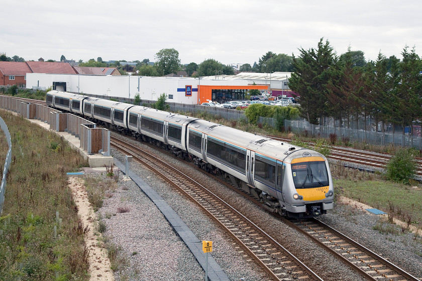 168215, CH 15.09 Oxford-London Marylebone (1Y41, 3L), Bicester Gavray Junction 
 168215 leaves the east-west line (in the background) at the new Gavray Junction in Bicester. The unit, working the 15.09 Oxford to Marylebone is about to make the short climb up to Bicester South Junction on the new chord and then join the Chiltern Line for the rest of its journey to London. 
 Keywords: 168215 1Y41 Bicester Gavray Junction