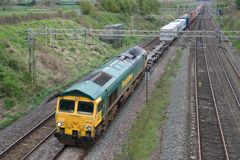 66546, 13.13 Felixstowe North-Lawley Street (4M93, 11E), Victoria bridge 
 The daily 13.13 Felixstowe North to Lawley Street 4M93 Freightliner passes through the Northamptonshire countryside near the village of Roade leading with 66546 leading. Stretching off into the distance the 4M93 was well loaded as were all the freights observed on this dull Thursday afternoon. 
 Keywords: 66546 13.13 Felixstowe North-Lawley Street 4M93 Victoria bridge