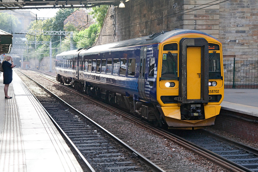 158702, SR 16.21 Glenrothes-with-Thornton-Tweedbank (2T52), Edinburgh Waverley station 
 158702 arrives into Waverley's platform twenty with the 16.21 Glenrothes-with-Thornton to Tweedbank. Edinburgh. With passenger usage of twenty-four million and rising, Waverley is the UK's eighth busiest station it was certainly a pretty frenetic place to be at teatime on a Friday even though this scene does not look it! 
 Keywords: 158702 16.21 Glenrothes-with-Thornton-Tweedbank 2T52 Edinburgh Waverley station