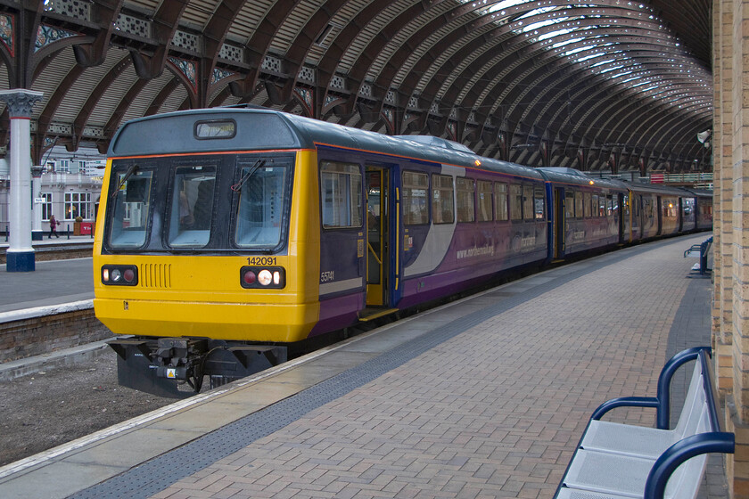 142091, NT 16.11 York-Leeds (2C45), York station 
 Seen yesterday also at York station Pacer 142091 waits in the north-facing bay platform to work the 16.11 to Leeds via Harrogate. 
 Keywords: 142091 16.11 York-Leeds 2C45 York station Northern Pacer