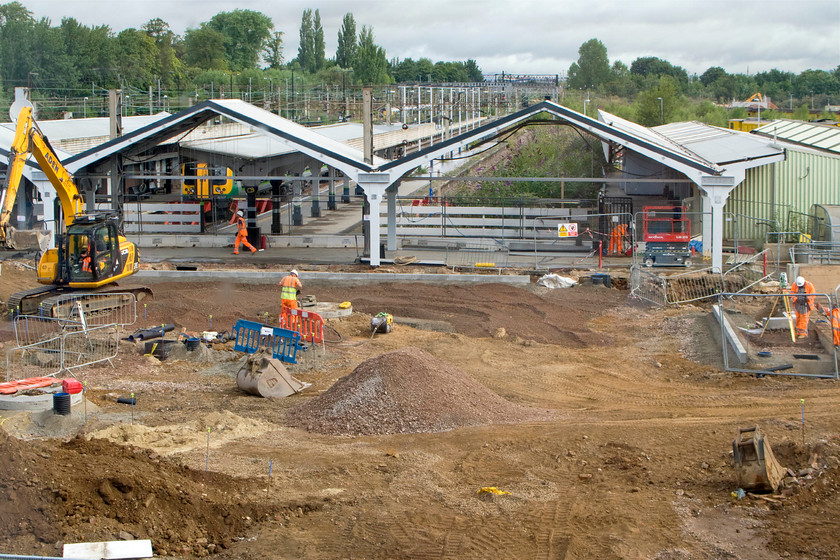 Demolition of old Northampton station 
 With the new Northampton station having been opened for nearly six months, work continues to complete the outside areas. In this view, the taxi rank and the turning circle is being prepared for tarmacking. 
 Keywords: Demolition of old Northampton station