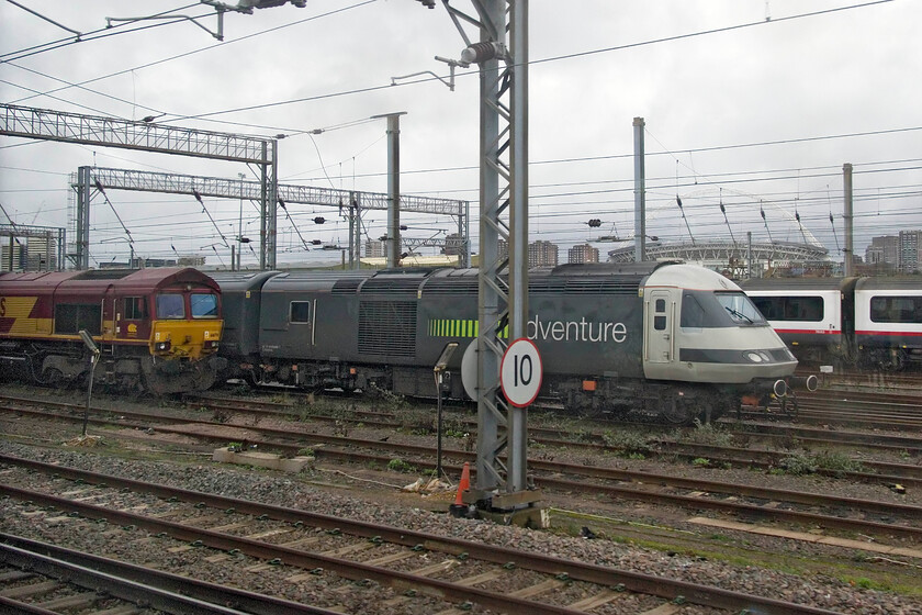 66176 & 43480, stabled, Wembley Yard 
 66176 and Rail Adventure's 43480 are seen stabled in Wembley yard. The former Grand Central HST power car was being used the following day to move some new stock, something that they are doing a lot of at the moment including taking some back into storage at places such as Long Marston; what a farce! 
 Keywords: 66176 43480 stabled Wembley Yard Rail Adventure