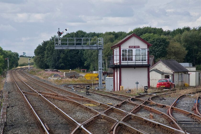 Appleby North signal box (LMS, 1951) 
 It appears that Network Rail has been undertaking some restoration and maintenance of Appleby North signal box with the 1951 LMS Type 11c+ structure looking very smart but it's a shame that the huge modern signal post and beam have been located adjacent to it! There were once a number of boxes in and around Appleby, the town even having two stations that were very close to each other. The sidings seen in this photograph lead to the Appleby Heritage Centre. 
 Keywords: Appleby North signal box LMS