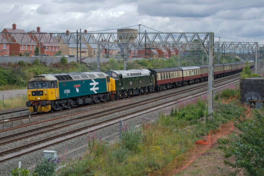 47593 & D213, 14.10 Bletchley CS-Crewe HS (5Z29, 34E), site of Roade station 
 Between them, 47593 'Galloway Princess' and D213 'Andania' had worked the previous day's English Riviera Express charter from Northampton to Kingswear in top and tail manner. On arrival back at Northampton late the previous evening the stock returned the short distance south to Bletchley for overnight stabling. It is now seen returning to its LSL base at Crewe as the 14.10 ex-Bletchley CS running as 5Z29 passing Roade. The enthusiasts gathered to capture the train were, of course, hoping that D213 would be leading but, as can be seen, 47593 was removed from the rear to lead the stock to Crewe prior to departure but the scene is pretty good nonetheless! 
 Keywords: 47593 D213 14.10 Bletchley CS-Crewe HS 5Z29 site of Roade station Galloway Princess