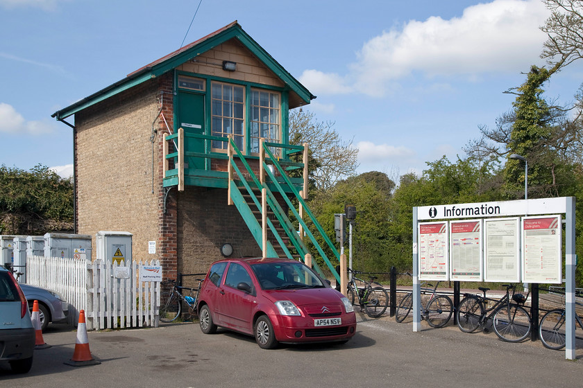 Dullingham signal box (GE, 1883) 
 The rear view of Dullingham signal box situated between Newmarket and Cambridge. It's nice to see that the windows in the 1883 Great Eastern box have not been replaced with ghastly and quite out of character UPVC windows. It is a typical brick structure in the GE style using buff bricks but the timber work is rather on the plain side. It's possible that this has been replaced over the years as one would expect some more ornate weatherboarding and the like. The station is served by Greater Anglia services that run between Ipswich and Cambridge. 
 Keywords: Dullingham signal box