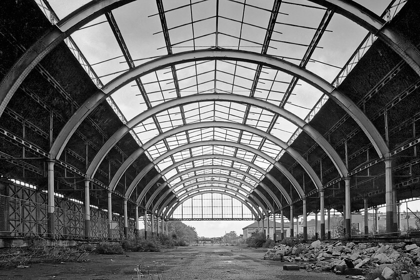 Interior of trainshed, Bath Green Park station 
 A reverse angled view of https://www.ontheupfast.com/p/21936chg/30023071321/interior-trainshed-bath-green-park is seen here looking through the length of the fine train shed of Bath's Green Park station. It is not widely known that until 1951 the station was named Bath Queen Square named after the fine Georgian square a quarter of a mile away. 
 Keywords: interior of trainshed,Bath Green Park station