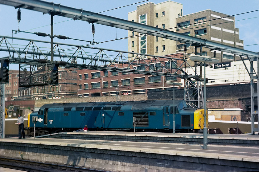 40101, stabled, London King's Cross station 
 40101 basks in the early summer sunshine at London King's Cross station. It is sitting in the recently created stabling point on the eastern side of the station. Behind it the remains of York Road station is undergoing demolition. 40101 survived as far as 1982 then languishing on for another two years at Crewe before being broken up in November 1984. 
 Keywords: 40101 stabled London Kings Cross station