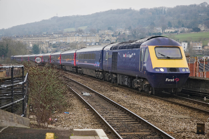 43175, GW 11.30 London Paddington-Bristol Temple Meads, Bath Spa station 
 The 11.30 Paddington to Bristol HST service arrives at Bath Spa with power car 43175 'GWR 175th Anniversary' leading. This scene is one to cherish as the arrival of the electrification masts and wiring will ruin this view when the programme is completed. This scene bears some similarities to a photograph that I took nearly forty years ago but then the motive power was a little different, see.... https://www.ontheupfast.com/p/21936chg/24037709804/b578-bath-spa-station

NB Of course, my comments above about the forthcoming electrification have not come to pass with the decision to stop the wires at Thingley Junction some ten miles to the east of Bath (SCR, 2023). 
 Keywords: 43175 11.30 London Paddington-Bristol Temple Meads Bath Spa station FGW First Great Western HST GWR 175th Anniversary