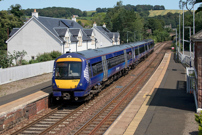 170470, SR 12.40 Edinburgh Waverley-Glenrothes with Thornton (2K01, 2L), Aberdour station 
 170470 leaves the delightful station at Aberdour with the 12.40 Edinburgh to Glenrothes with Thornton service. This was a lovely station, even though not much is seen in this image apart from some bare platforms! It was opened by the North British Railway in 1890 and today the building is adorned with flowers and hanging baskets. 
 Keywords: 170470 12.40 Edinburgh Waverley-Glenrothes with Thornton 2K01 Aberdour station