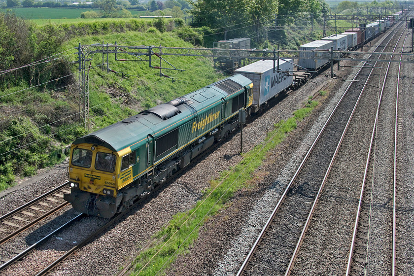 66956, 07.50 Felixstowe North-Lawley Street (4M94, 52E), Victoria bridge 
 Penultimate numbered member of the 66 class 66956 makes its way down the WCML past Victoria bridge between Roade and Ashton. It is leading the 07.50 Felixstowe to Lawley Street 4M94 that was both long and well loaded on this particular occasion. 
 Keywords: 66956 07.50 Felixstowe North-Lawley Street 4M94 Victoria bridge Freightliner