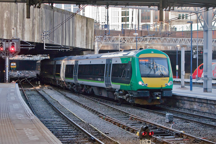 170632, LM 14.40 Hereford-Birmingham New Street (1M89), Birmingham New Street station 
 170632 arrives into Birmingham New Street with the 14.40 from Hereford. In this busy scene, a class 221 Voyager waits at a nearby platform and a class 323 emerges from the doom of one of the many tunnels that surround the station. 
 Keywords: 170632 14.40 Hereford-Birmingham New Street 1M89 Birmingham New Street station